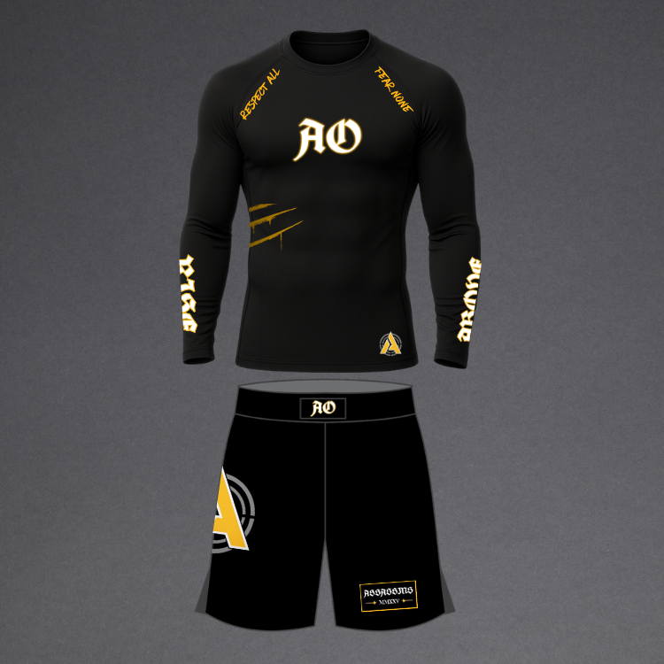 A black long-sleeve athletic compression shirt and matching black shorts set with gold and white graphics, displayed on a neutral gray background.